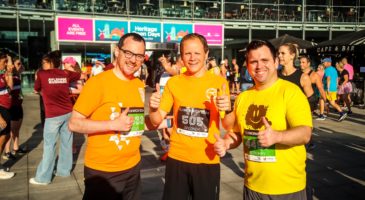 three men in orange tops 