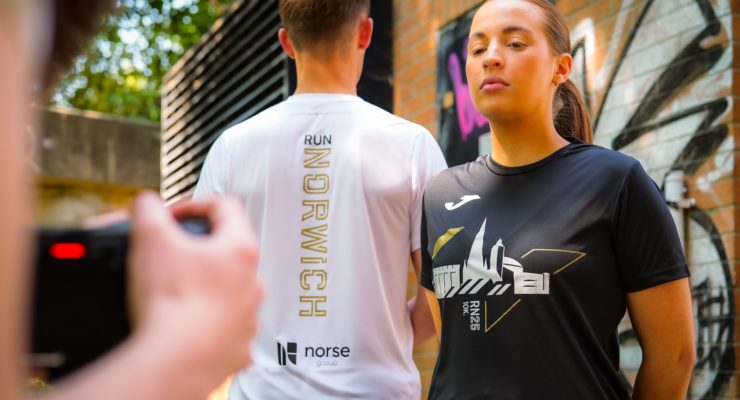 woman in black tshirt and man with back to camera in white tshirt