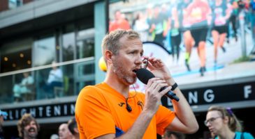 Run Norwich volunteer with microphone