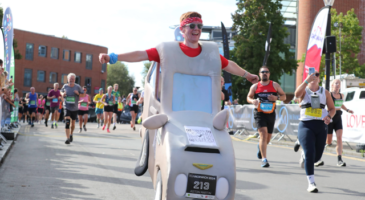 Man running in car costume