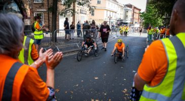 wheelchair user crossing finish line