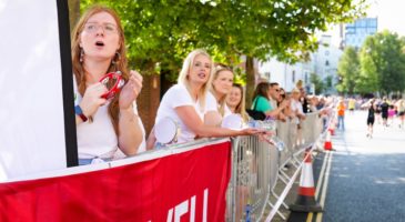 girls with tambourines behind lovell banner