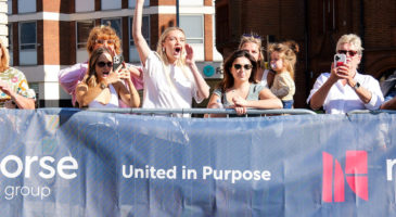 norse banner with people behind it