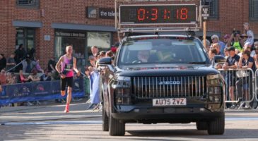 Charity runner with medal at Run Norwich 2025