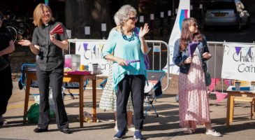 three ladies looking to their left
