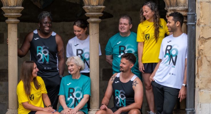 group of six people wearing run Norwich race day tops