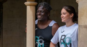 man and woman wearing a run norwich race day top