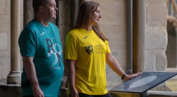 man and woman wearing run norwich tops