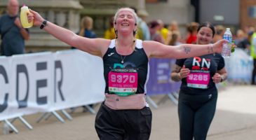 A runner nears the Run Norwich 2026 finish line 